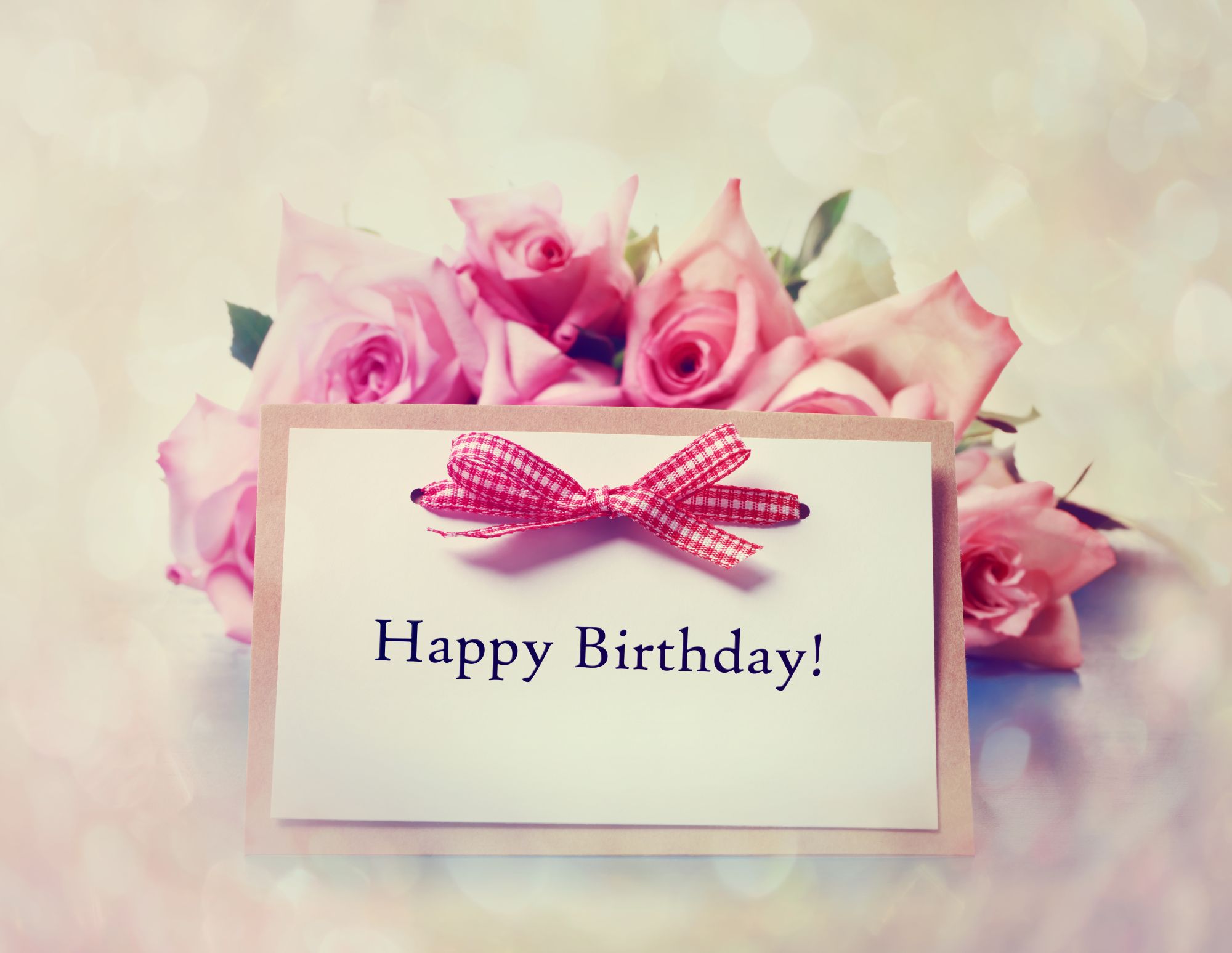 Phone screen showing a digital birthday card with music and confetti animation
